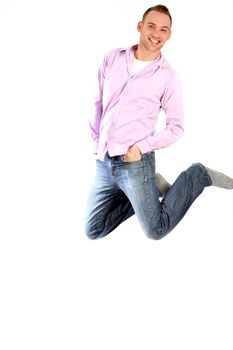 young man jumps up to throw us back-legs against a white background with textile
