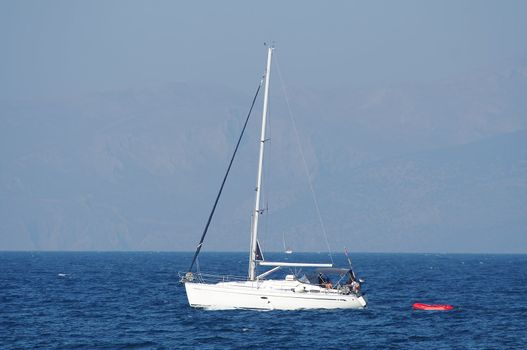 White yacht seen from shore