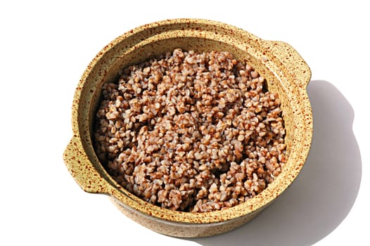 Buckwheat friable porridge in a ceramic saucepan