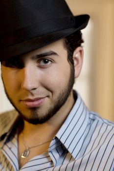 Handsome Young Man Indoors Wearing a Fedora Hat