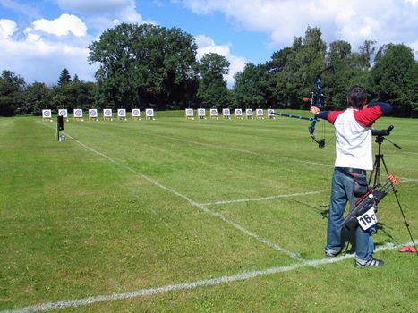 An official target shooting - an archer aim and shoots 