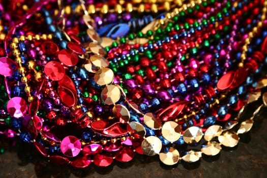 A background image of strings of colorful beads.