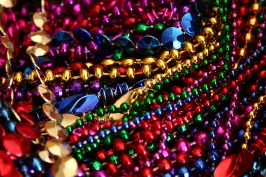 A background image of strings of colorful beads.