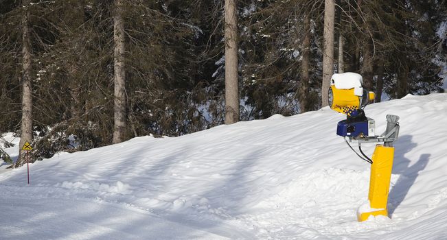 snow cannon in italian Dolomites