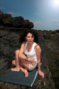 a beautiful woman doing yoga to show a healthy way to live a happy and relaxed lifestyle in a world full of stress