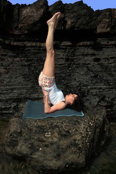 a beautiful woman doing yoga to show a healthy way to live a happy and relaxed lifestyle in a world full of stress