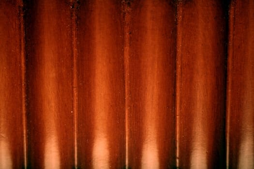 A close-up of a red wooden background.