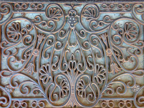 Ornate antique doormat made of cast iron