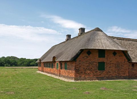 straw and brick barn house