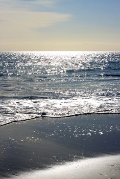 Sparkling Stars of Evening Sunlight on Ocean Waves.  Grange Beach, Adelaide, Australia