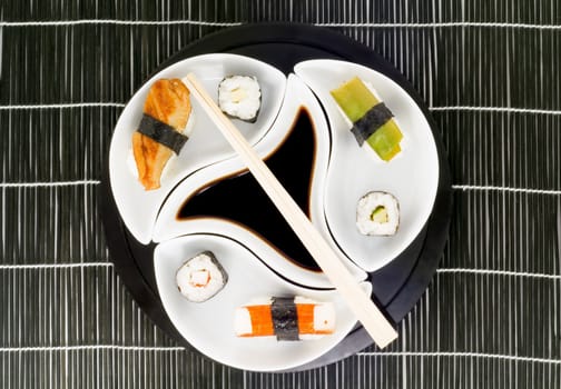 a plate with different kinds of sushi