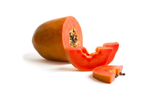 Slice of bright orange sweet mellow papaya isolated on white