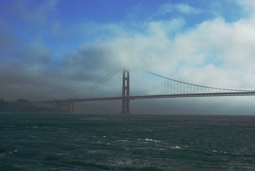 The Golden Gate bridge surrounded by the many colors of nature.