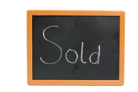 chalkboard with the text sold isolated on white
