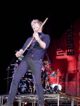 Duran Duran guitarist Dom Brown live on stage in Malta on 26th July 2008 during Red Carpet Massacre Tour