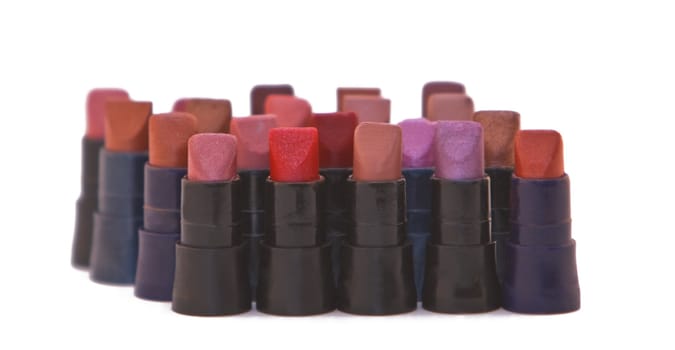 Group of lipstick samples against a white background.