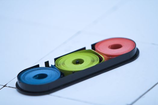 Indicator paper on a faience lab desk.