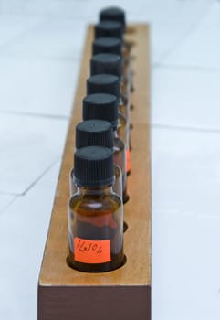 Image of a row of brown laboratory bottles.