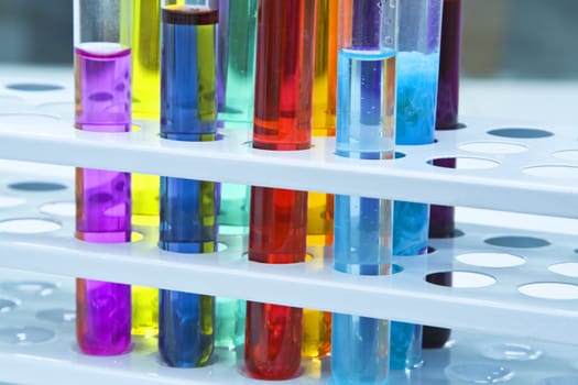 Colorful image of a test tubes stand; unmodified specific lighting for a laboratory.