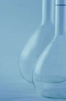 Laboratory flask in a blue environment.