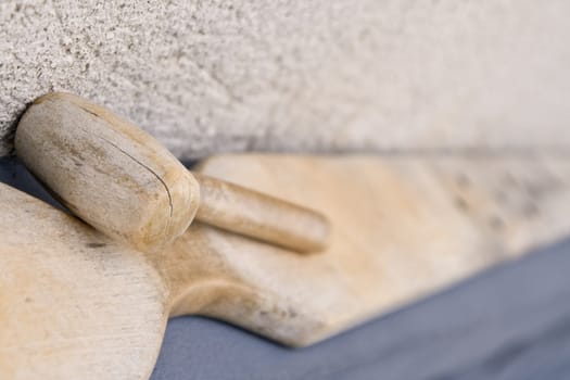 Artistic image of a bell board and a specific wooden hammer.Traditional tools for Moldavian Romanian Monasteries.