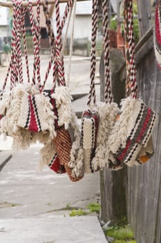 Traditional romanian bags made of wool.They are hung on the home's wooden fences in the street for selling.They are characteristic for a certain part of Transylvania called Oasului Country.