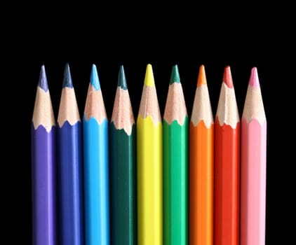 Color pencils on a black background.