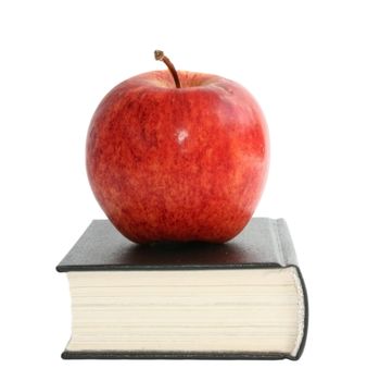 Red apple on the book.