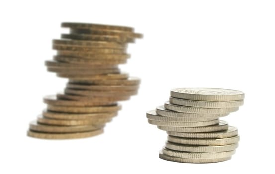 Two piles of coins on a white background