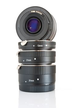 camera lens and a set of extension tube used for macro photography isolated on white background
