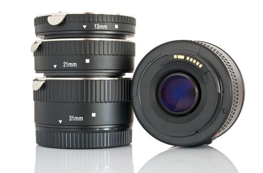 camera lens and a set of extension tube used for macro photography isolated on white background