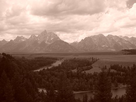 A view of the Grand Teton range shot in sepia.