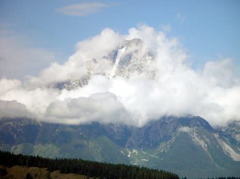 Wyoming’s Mt. Moran peeks through its cloudy vail.