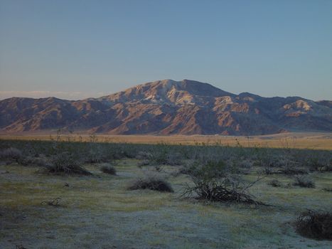 The mountains of Joshua Tree National Park reflect the evening light.