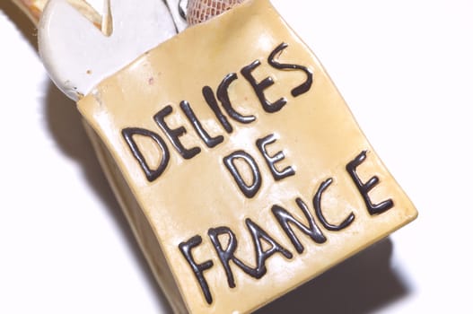 french delices miniature shopping bag, isolated on white