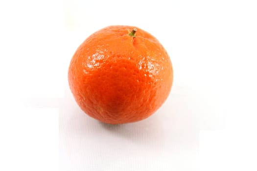 A ripe orange isolated on white.
