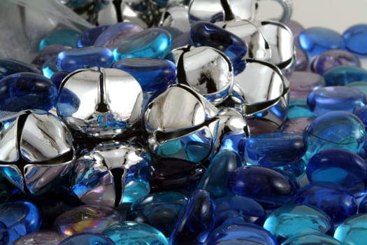 Silver Christmas bells with blue glass stones.