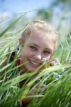 Beautiful smiling girl gathering flowers. #3