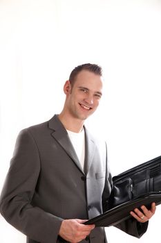 A businessman with a folder containing a white background and space for text