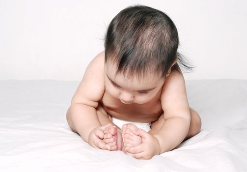  The baby of six months on a light background