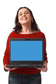 Portrait of a pretty young woman holding a laptop standing isolated on white 