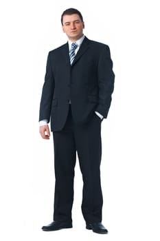 Full length of a confident young business man standing against white with one hand in his pocket 