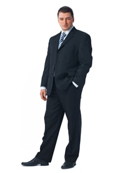Full length of a confident young business man standing against white with one hand in his pocket 