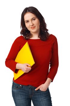 Young colleague female student holding folder and with other hand in her pocket over white background 