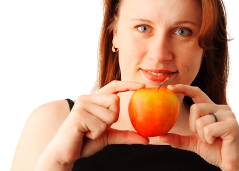 Closeup portrait of a young pretty woman holding a red apple in her hand, isolated over white background 