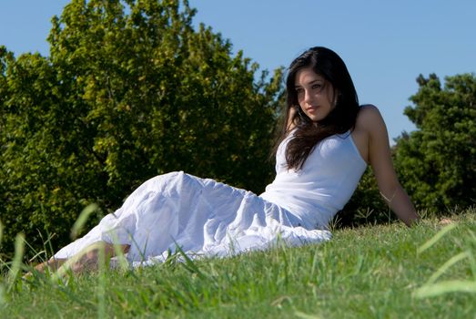 Relaxing girl on meadow