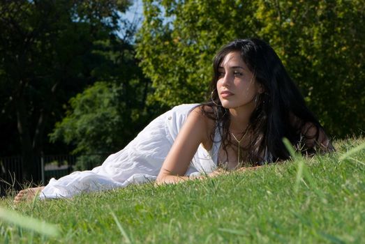 Relaxing girl on meadow