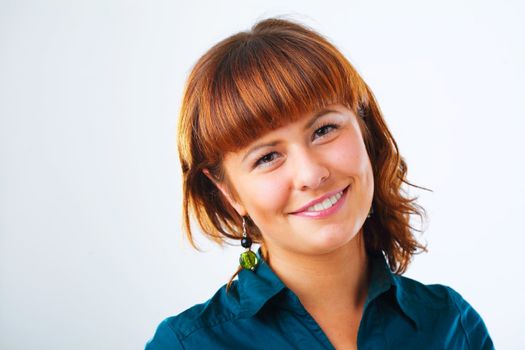 Happy young woman smiling with friendly look