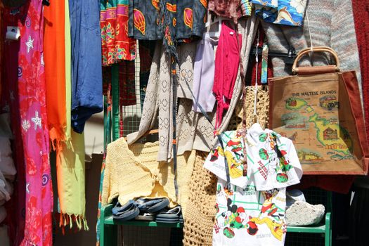clothes for sale at a market stall