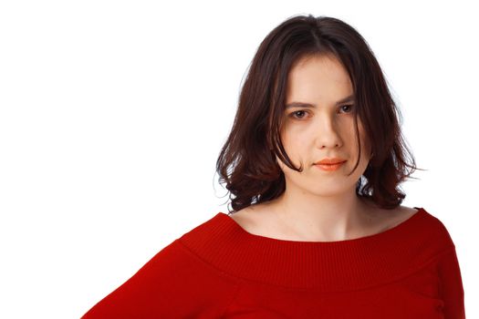 Portrait of a beautiful serious young female dressed in red jersey isolated against white background 